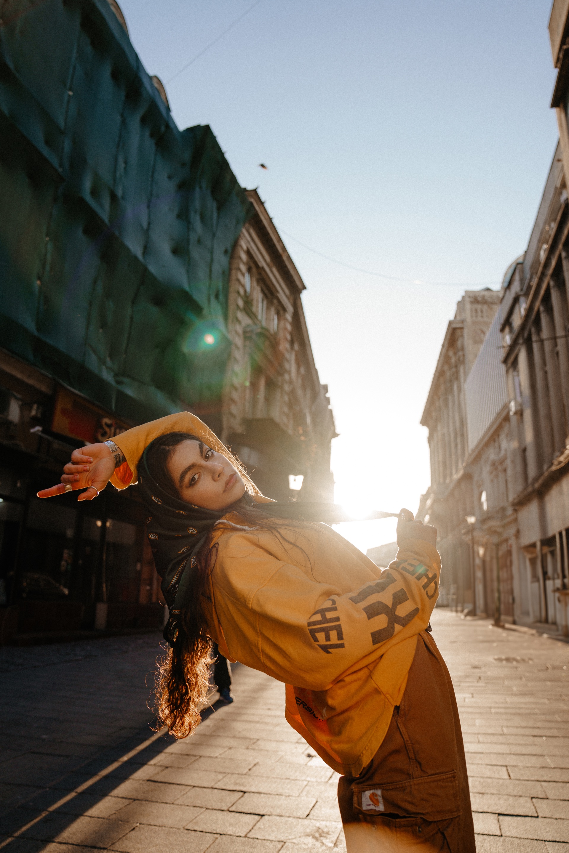 Creative portrait in golden street light
